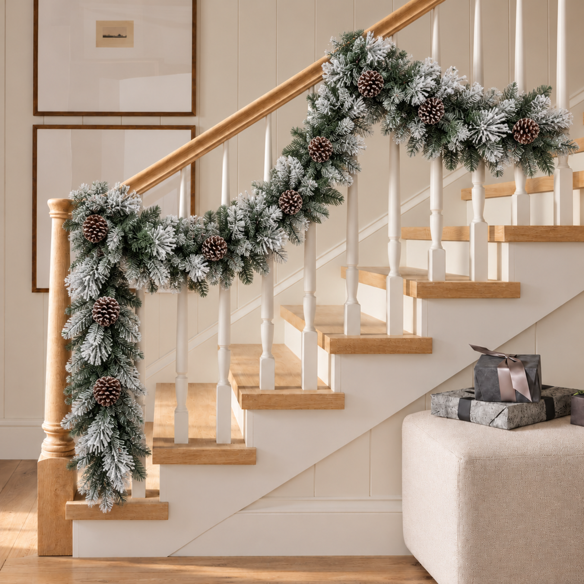 Snow flocked pine garland wrapped along a staircase railing