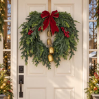 Christmas cedar wreath on a white front door with glass sidelights